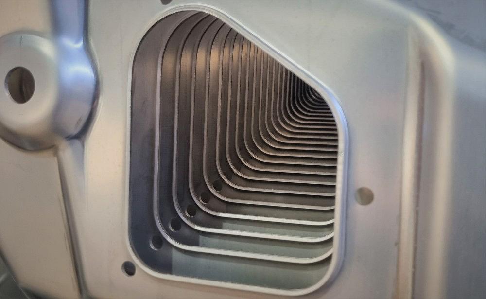 Close-up view of stacked metal press parts in series production